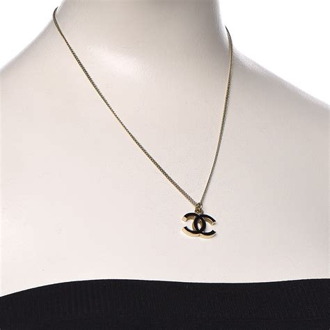 chanel black and gold necklace